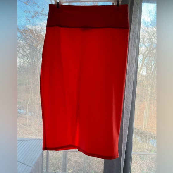 I’m in love with Derek hot orange pencil skit with opening in the back. Size L - Picture 2 of 6